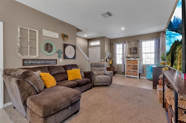 carpeted living room featuring tile patterned flooring, visible vents, baseboards, and recessed lighting