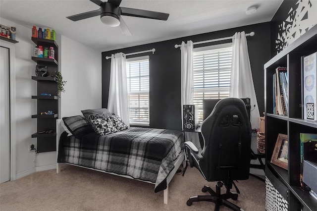 carpeted bedroom featuring ceiling fan