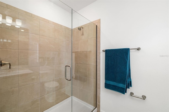 bathroom with a shower stall