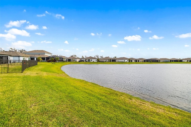 property view of water featuring fence and a residential view