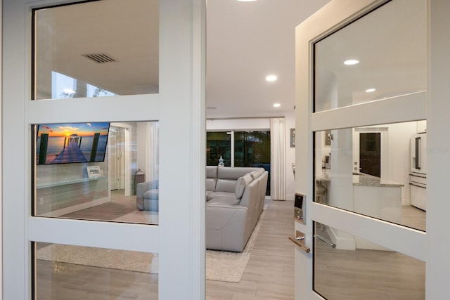 interior space featuring recessed lighting, visible vents, and wood finished floors