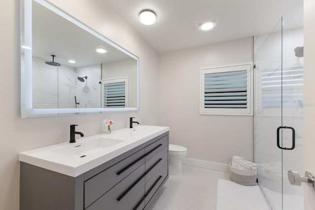 full bath featuring double vanity, a stall shower, and a sink