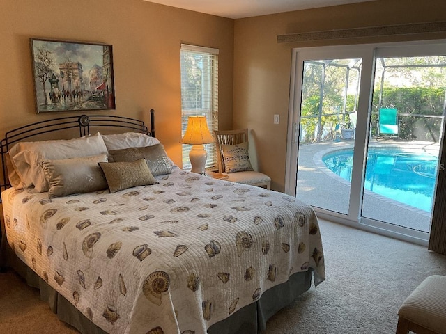 carpeted bedroom with multiple windows and access to outside