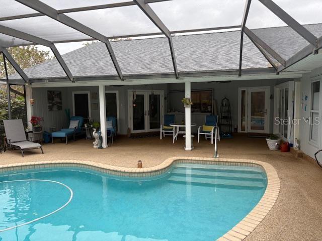 pool with a patio and french doors