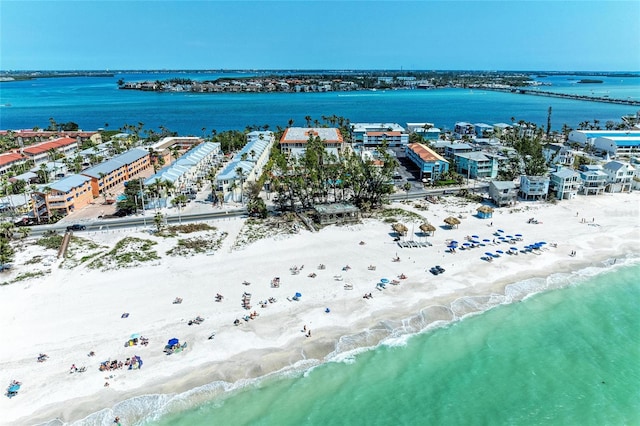 drone / aerial view with a beach view and a water view