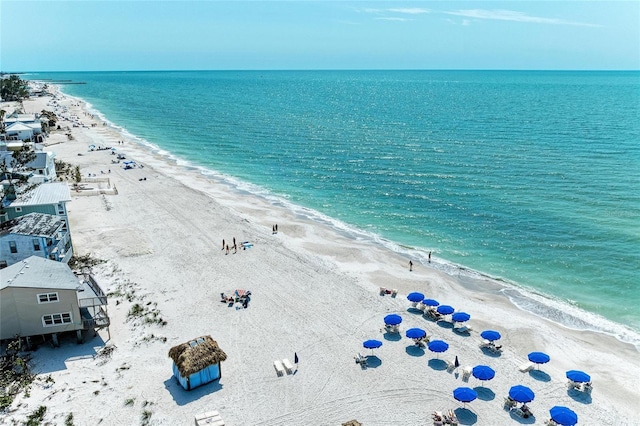 aerial view featuring a water view and a beach view