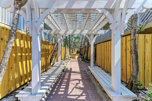 view of patio / terrace featuring a fenced backyard and a pergola