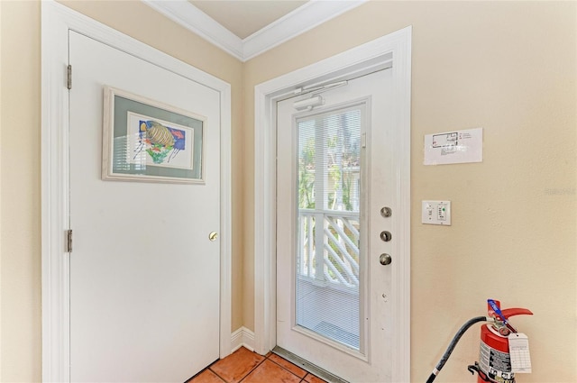 doorway to outside with light tile patterned floors and crown molding