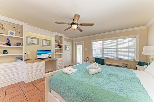 bedroom with light tile patterned floors, a ceiling fan, built in study area, ornamental molding, and access to outside