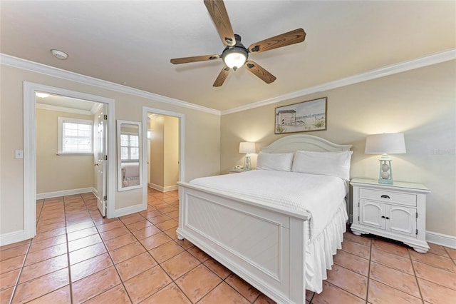 bedroom featuring baseboards, light tile patterned flooring, and crown molding