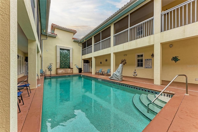 community pool with a patio