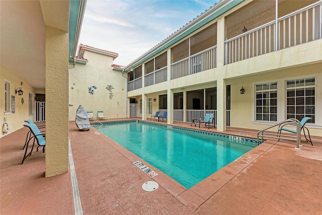 pool with a patio