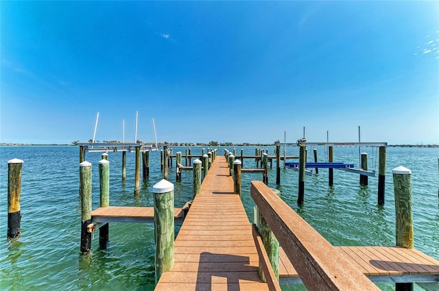 view of dock featuring a water view and boat lift