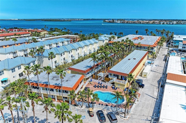 birds eye view of property with a water view and a residential view