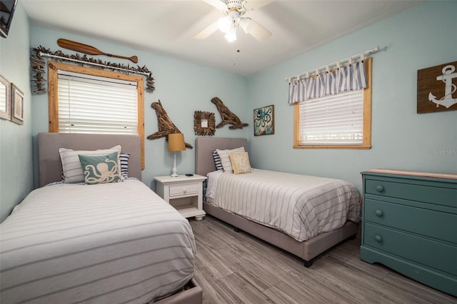 bedroom with wood finished floors and ceiling fan