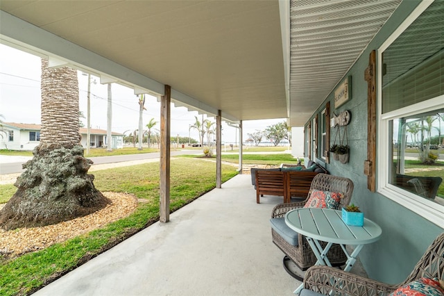 view of patio with a residential view and covered porch