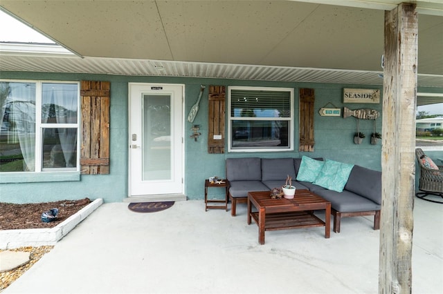 doorway to property with a porch and an outdoor living space