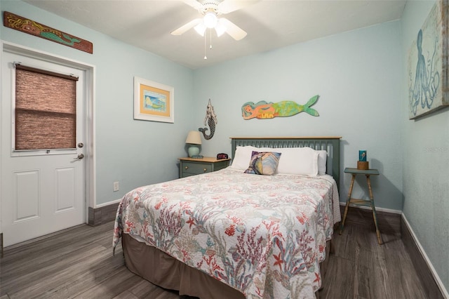 bedroom featuring ceiling fan, baseboards, and wood finished floors