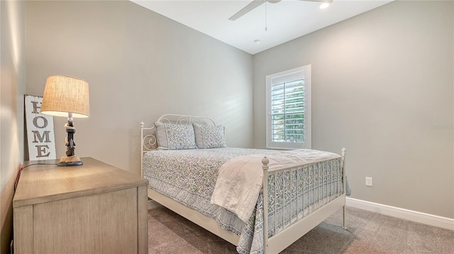 bedroom featuring a ceiling fan, carpet, and baseboards