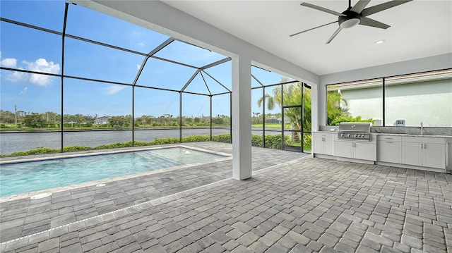 outdoor pool featuring a patio, a lanai, area for grilling, and grilling area