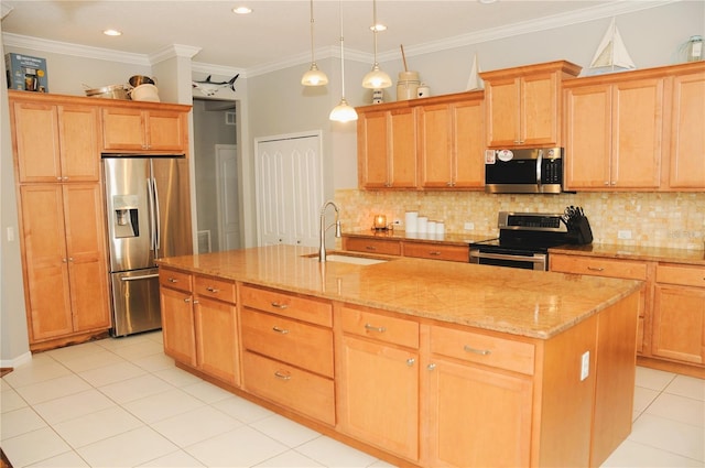 kitchen with an island with sink, a sink, appliances with stainless steel finishes, decorative backsplash, and light stone countertops