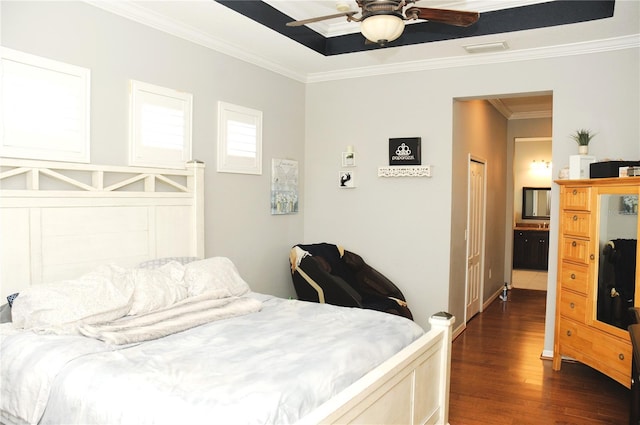 bedroom with ceiling fan, dark wood-style flooring, and ornamental molding