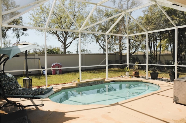 view of swimming pool featuring a lanai, a fenced backyard, a fenced in pool, and a patio