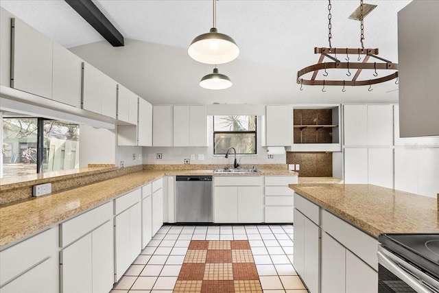 kitchen with stainless steel appliances, white cabinets, light countertops, and a sink