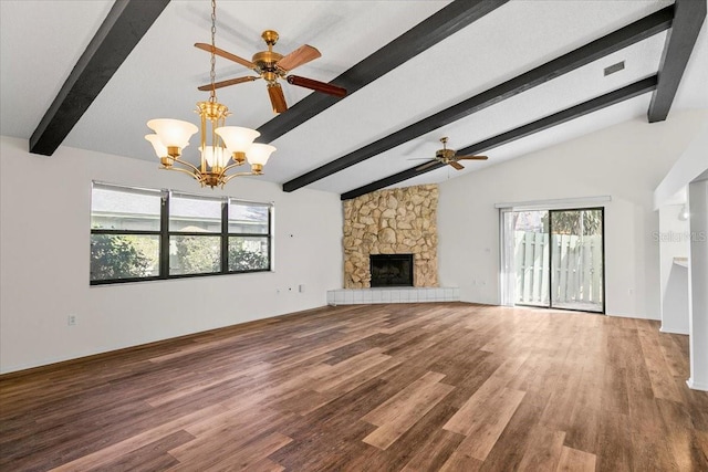 unfurnished living room with vaulted ceiling with beams, ceiling fan with notable chandelier, a fireplace, and wood finished floors