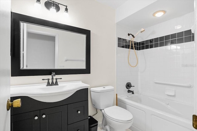 bathroom with washtub / shower combination, vanity, and toilet