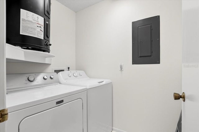 washroom with laundry area, electric panel, and separate washer and dryer