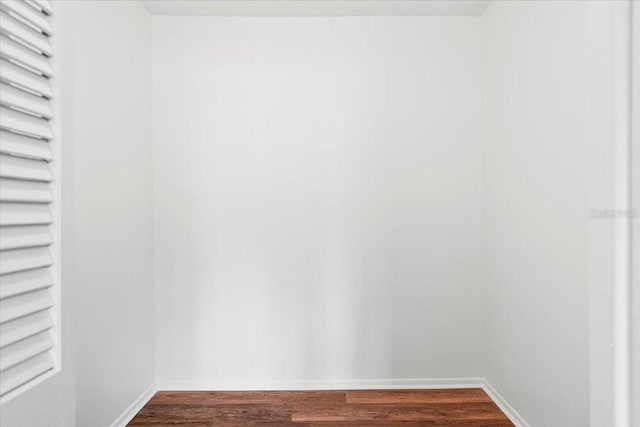 spacious closet featuring dark wood finished floors