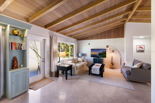 living area with speckled floor, wooden ceiling, and vaulted ceiling with beams