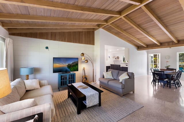 living area featuring speckled floor, beam ceiling, high vaulted ceiling, and wooden ceiling