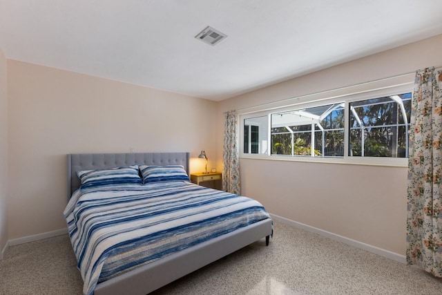 carpeted bedroom with baseboards and visible vents