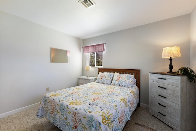 bedroom featuring visible vents, baseboards, and carpet floors