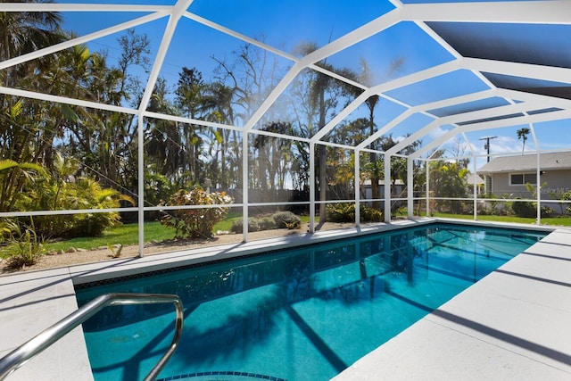 outdoor pool with a lanai and a patio