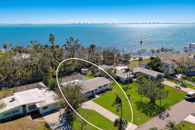 birds eye view of property with a water view