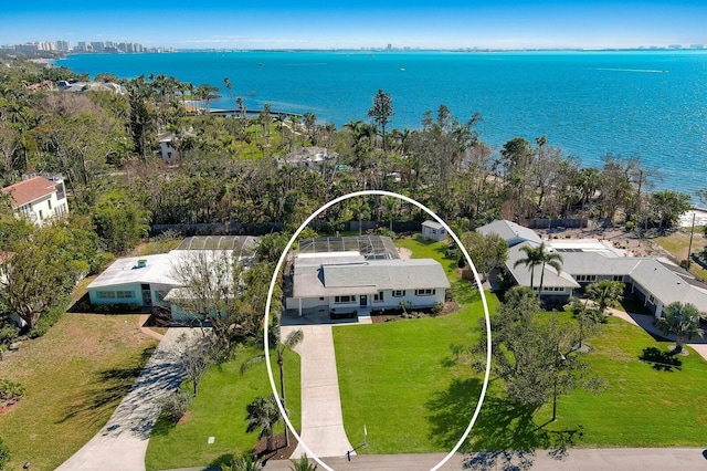 birds eye view of property with a water view