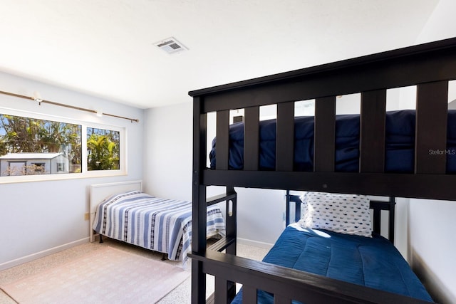 426 S Shore Dr, Sarasota, FL 34234 - bedroom with baseboards, visible vents, and carpet