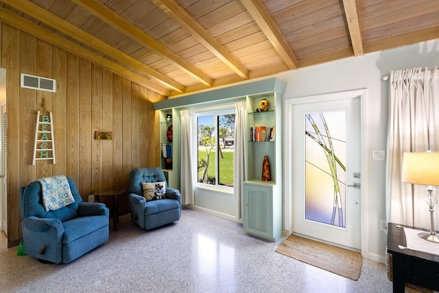426 S Shore Dr, Sarasota, FL 34234 - living area with wooden walls, visible vents, wooden ceiling, baseboards, and lofted ceiling with beams