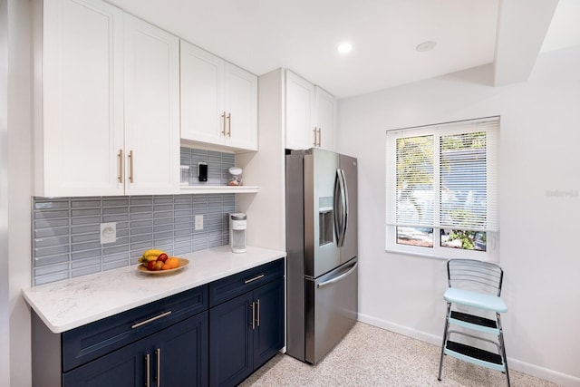 426 S Shore Dr, Sarasota, FL 34234 - kitchen with stainless steel fridge with ice dispenser, open shelves, baseboards, tasteful backsplash, and blue cabinetry
