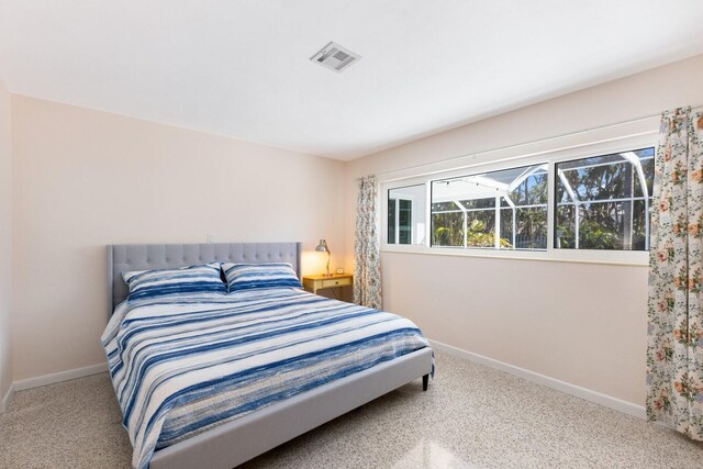 426 S Shore Dr, Sarasota, FL 34234 - carpeted bedroom with baseboards and visible vents