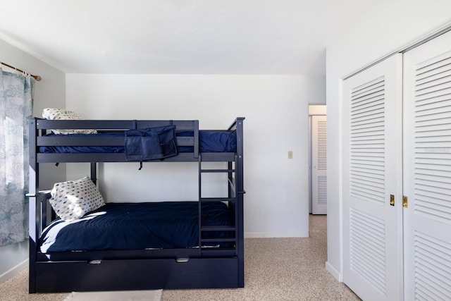 426 S Shore Dr, Sarasota, FL 34234 - bedroom featuring baseboards, carpet floors, and a closet