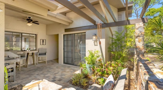 view of patio / terrace featuring outdoor dining space and a ceiling fan