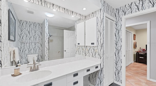 bathroom featuring tile patterned flooring, visible vents, wallpapered walls, vanity, and a shower