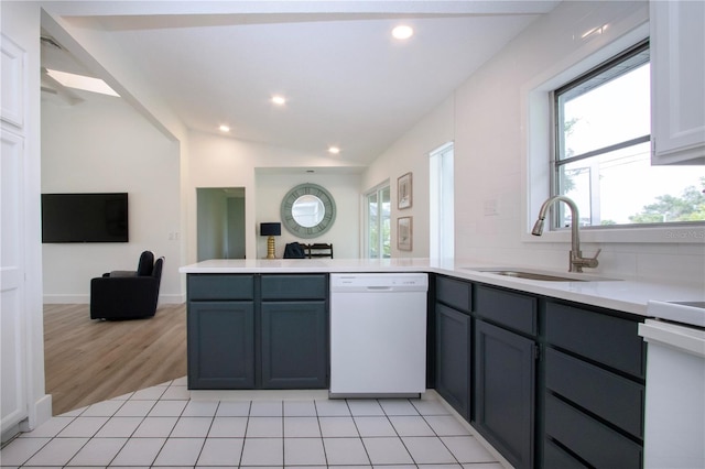 800 Everest Rd, Venice, FL 34293 - kitchen featuring light countertops, white dishwasher, a sink, a peninsula, and open floor plan