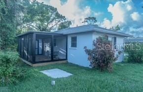 800 Everest Rd, Venice, FL 34293 - rear view of house with a yard