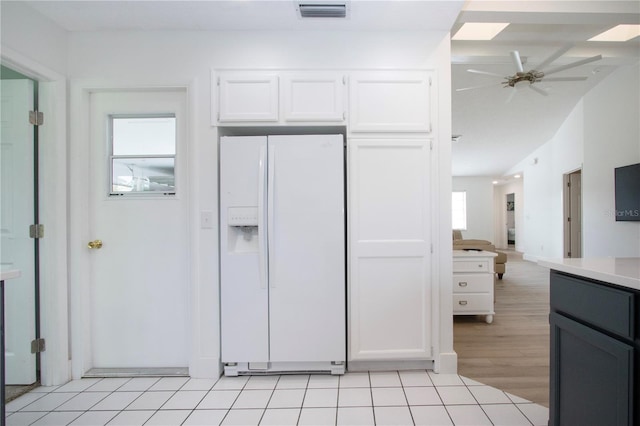 800 Everest Rd, Venice, FL 34293 - kitchen featuring white refrigerator with ice dispenser, a ceiling fan, visible vents, white cabinetry, and light countertops