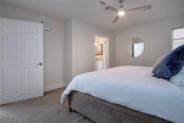 800 Everest Rd, Venice, FL 34293 - bedroom featuring carpet floors, ensuite bathroom, baseboards, visible vents, and a ceiling fan